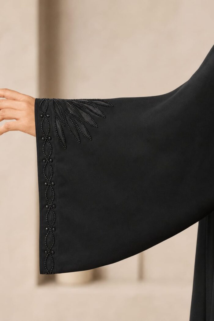 Stone embellished sunburst embroidery on black abaya cuff