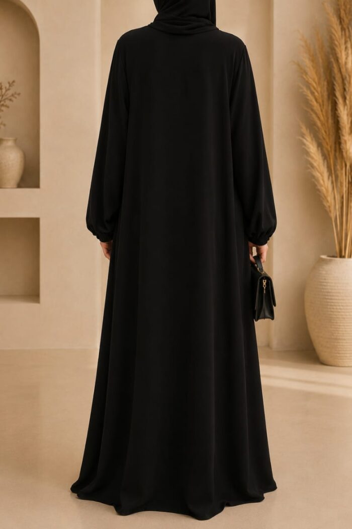 Black tassel abaya back view with matching hijab and gathered sleeves