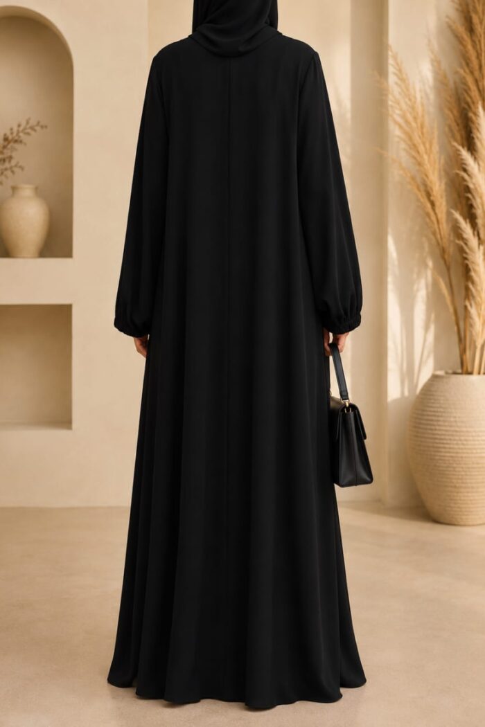 Black zoom tassel abaya back view with matching hijab and gathered sleeves
