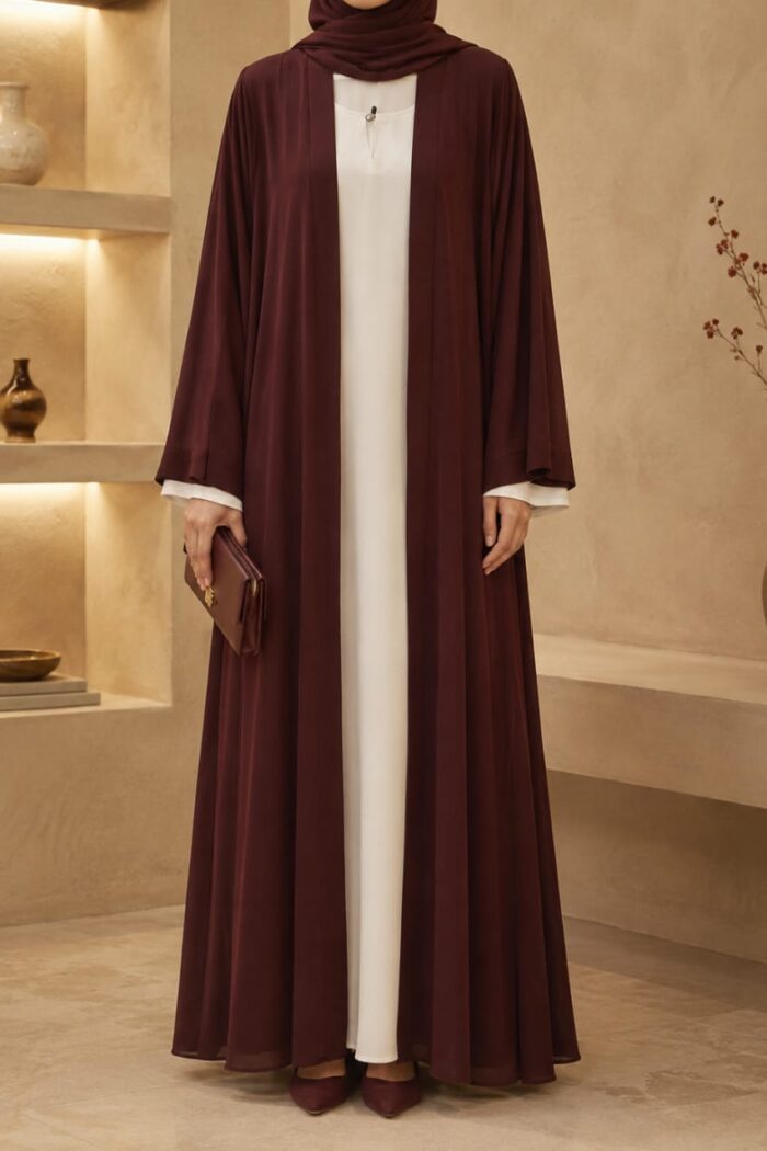 Dark brown lining abaya open front style worn over white inner Nida dress