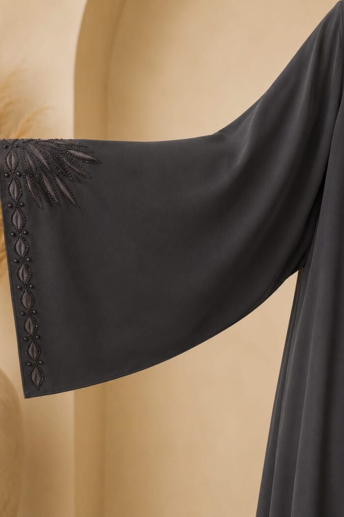 Stone embellished sunburst embroidery on dark grey abaya cuff