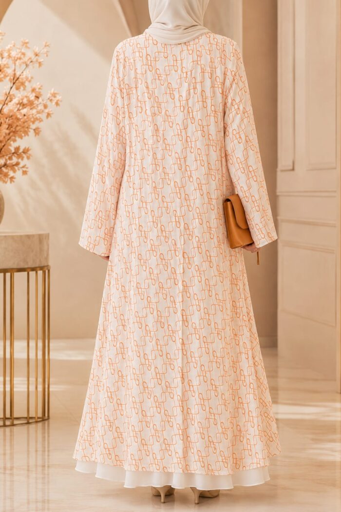 Falcon Printed Pearl Abaya in orange, back view showing layered geometric print and flowing silhouette