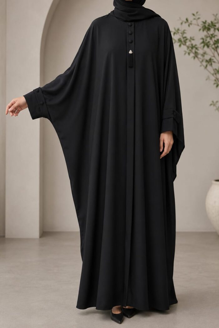 Kaftan bagi abaya in black with tassel neckline - front view