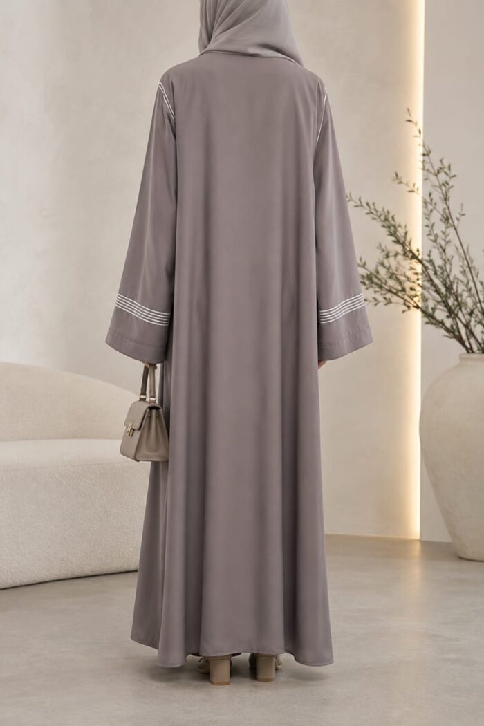 Light grey dori embroidered tasal gown with striped cuffs - back view
