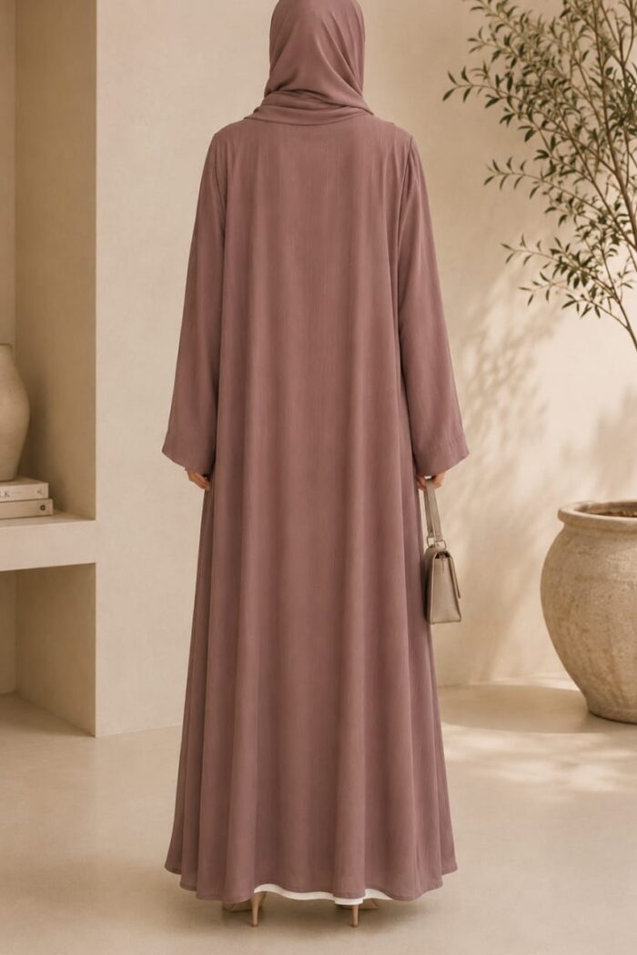 Mazdoja lining tench abaya in dusty pink with white inner dress - back view
