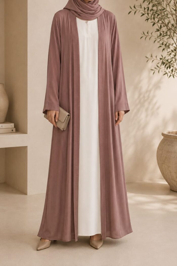 Mazdoja lining tench abaya in dusty pink open coat over white dress - front view