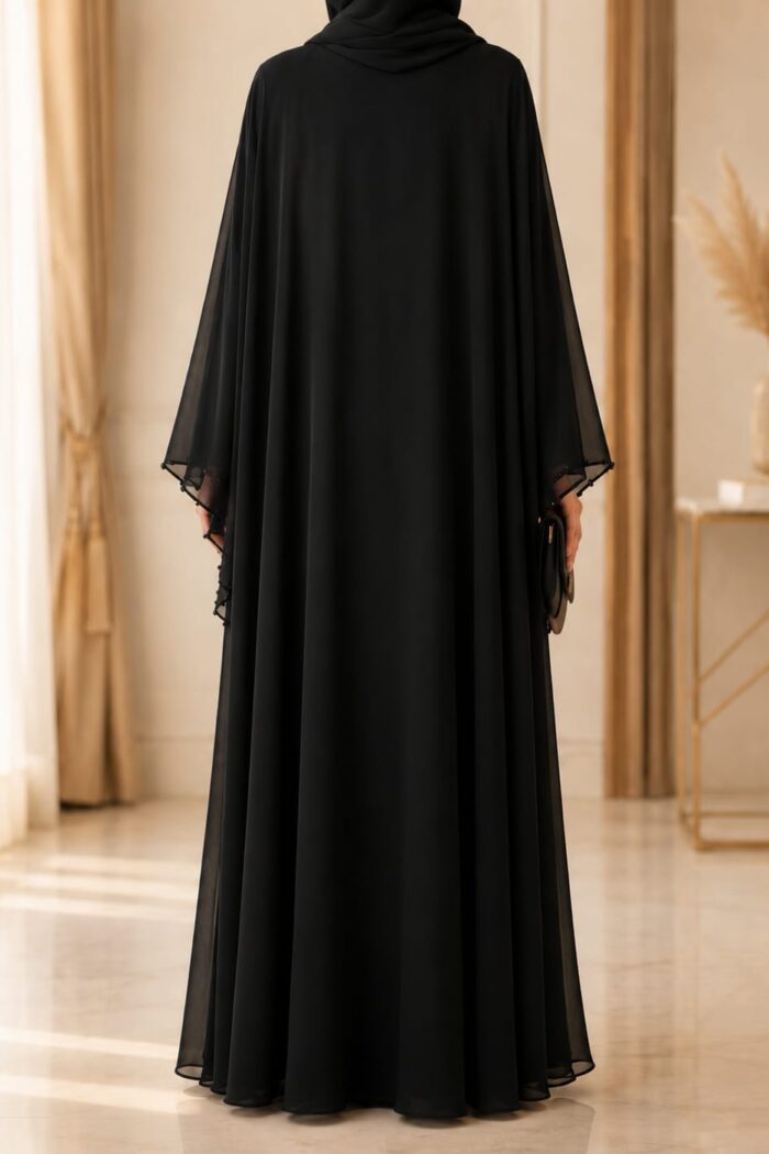 Mazdoja Single Beed Abaya in black, back view showing sheer sleeves and flowing silhouette