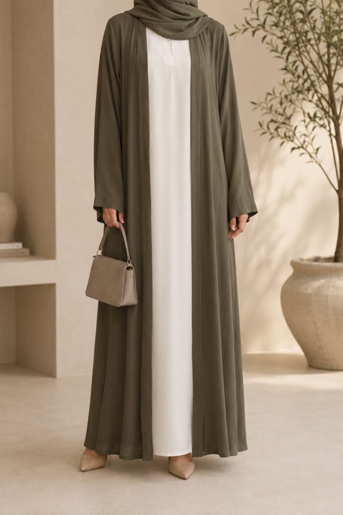 Olive green lining abaya open front style worn over white inner Nida dress