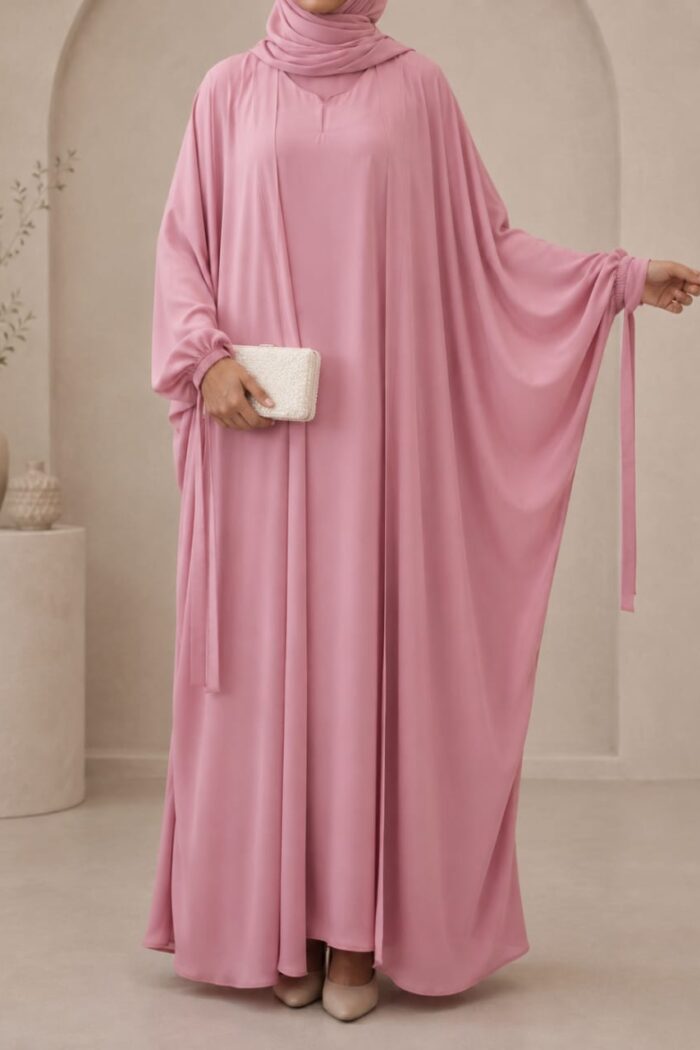 Shocking pink kaftan abaya front view with ribbon cuff tie detail