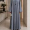 Tik Tok Asri Abaya in cashmere silver, front view with pleated tassel closure and cuff detail