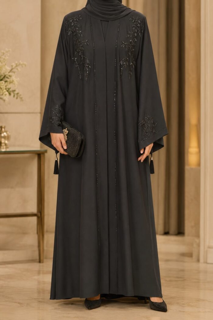 Zoom Arabian Katdana Abaya in black, front view with katdana embroidery on shoulders and open front