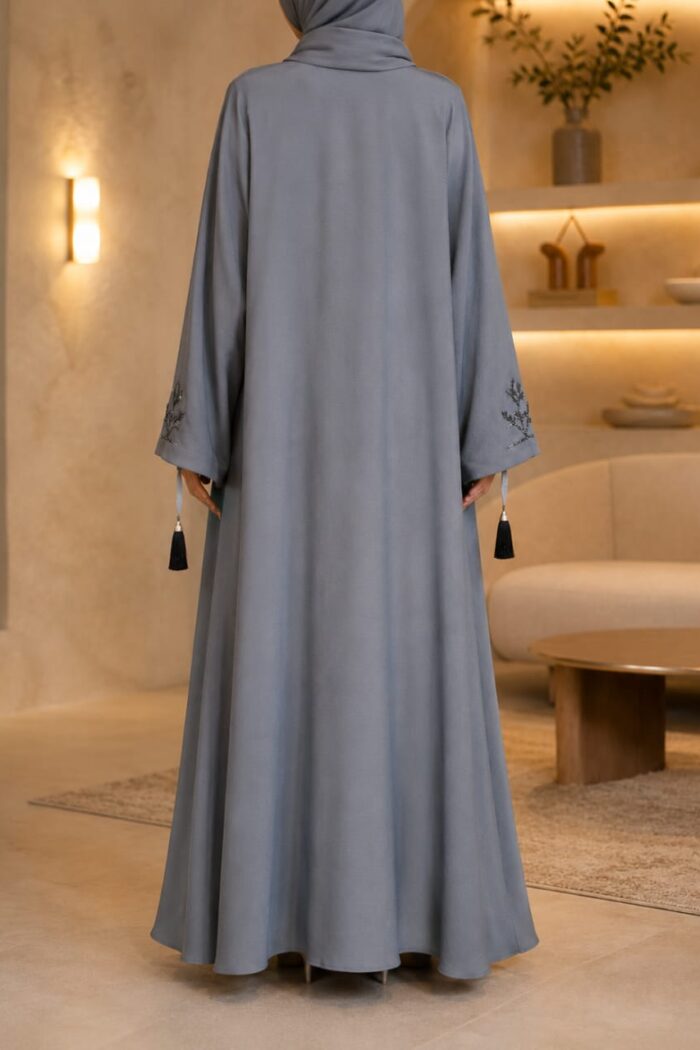Zoom Arabian Katdana Abaya in cashmere silver, back view showing flowing silhouette and cuff tassel detail