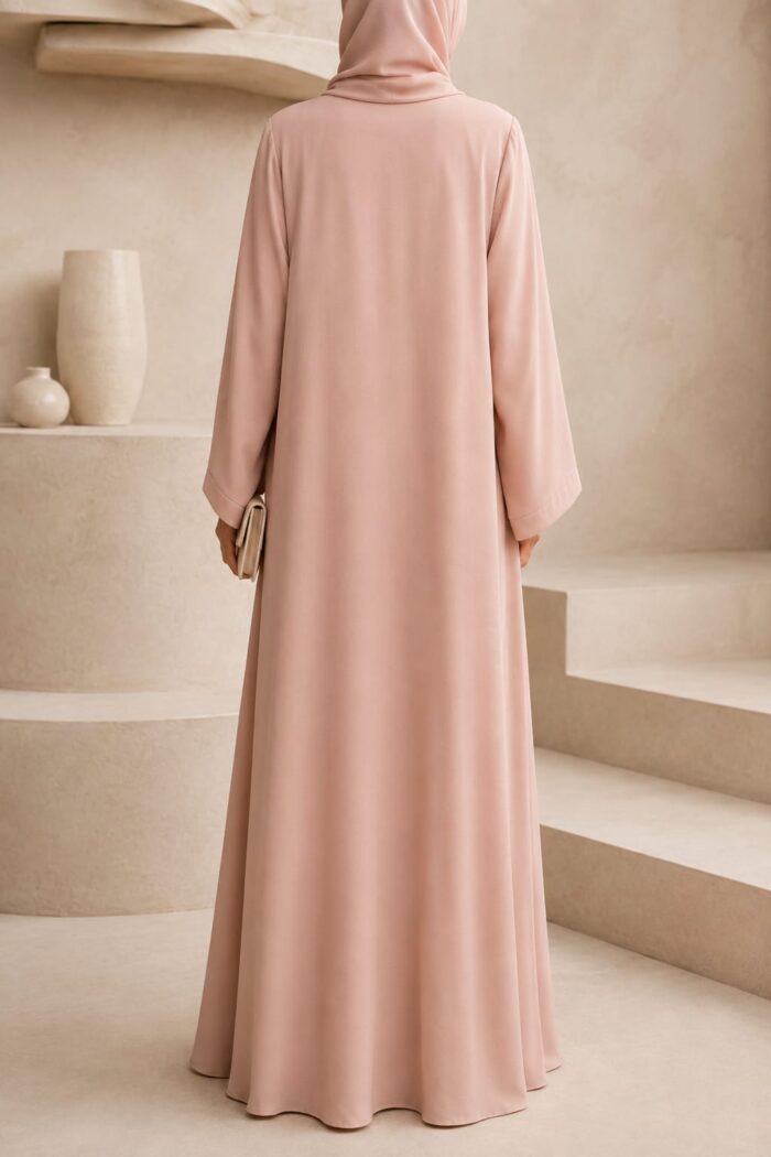 Zoom Plain Button Abaya in peach, back view showing clean silhouette and draped hijab