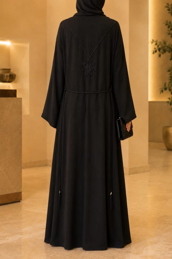 Zoom Zari Abaya in black, back view showing decorative stone motif and flowing silhouette