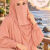 Peach colored Dori Naqabi, a Georgette niqab covering nose and face, worn with a matching peach abaya