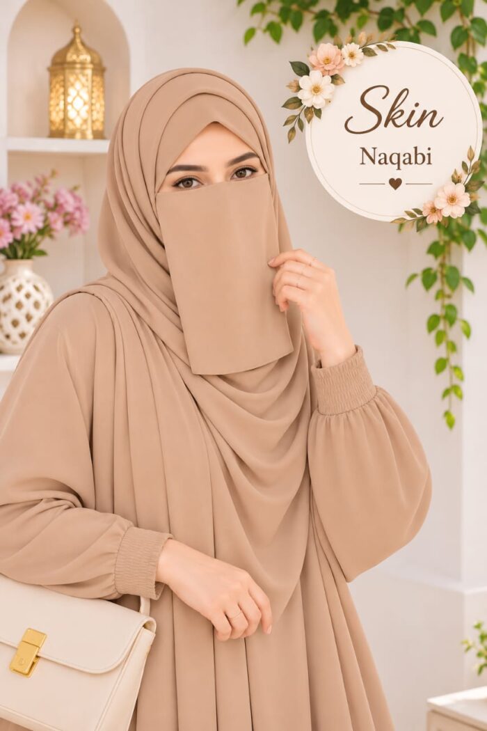 Skin pastel Dori Naqabi, a Georgette niqab covering nose and face, worn with a matching abaya and hijab